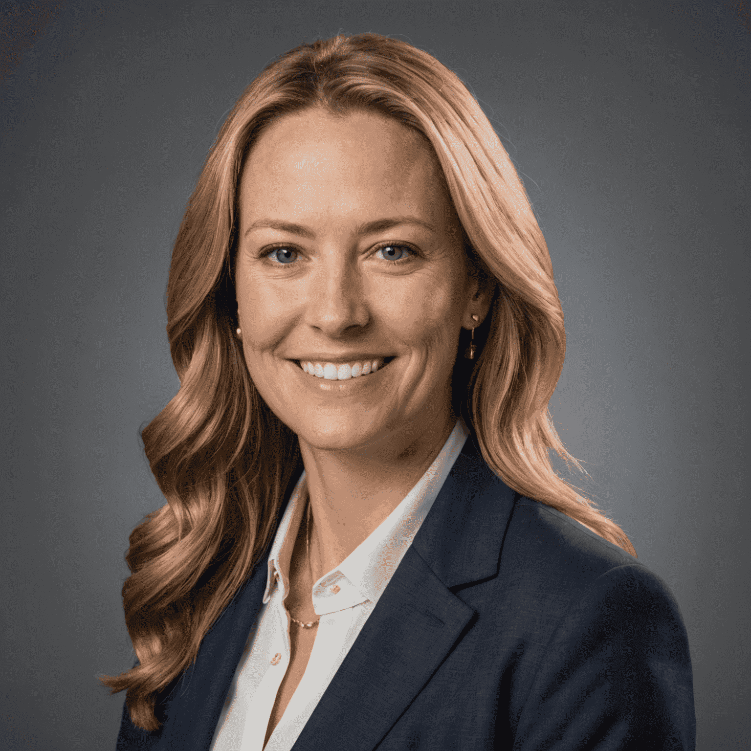 Headshot of Sarah Johnson, CFO of CoinServiceGolden, wearing a professional blouse and blazer, with a friendly smile